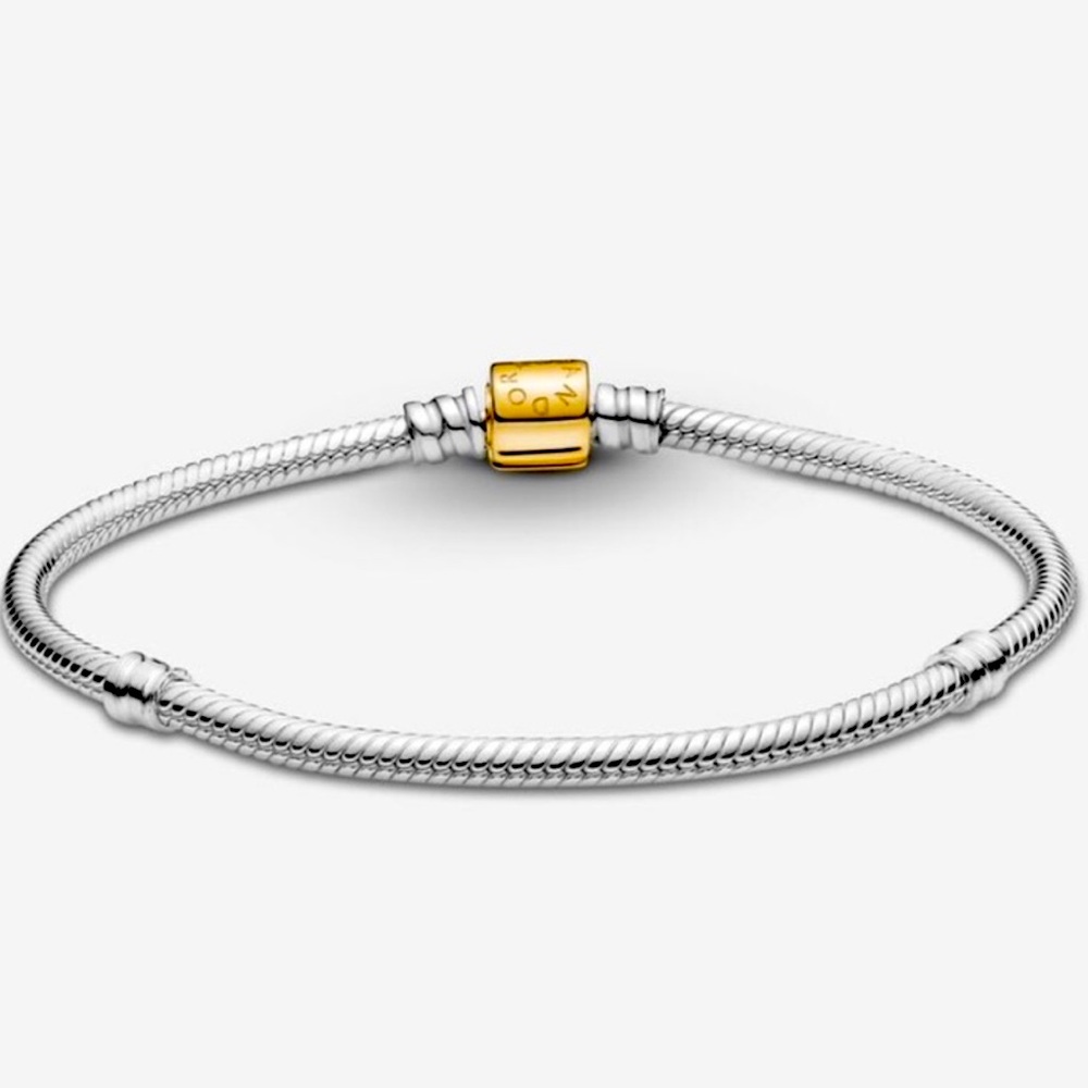 Authentic Pandora two tone 14 kt YG a& SS barrel bracelet.